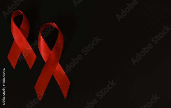 Fototapeta red ribbon symbol of World AIDS Day. Top view. Free copy space.