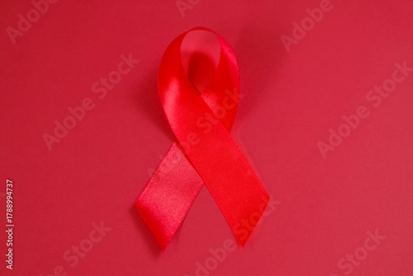 Fototapeta red ribbon symbol of World AIDS Day. Top view. Free copy space.