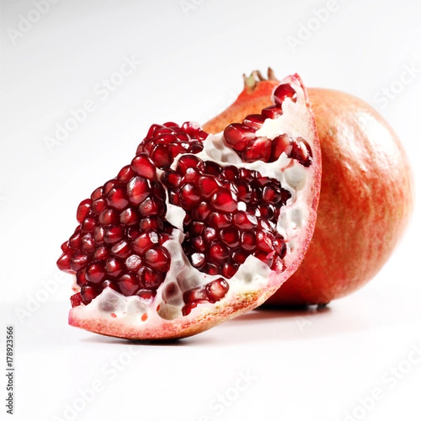 Obraz Two pomegrantes on a white  background.