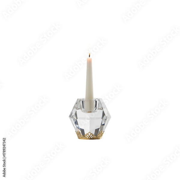 Fototapeta Isolated burning candle and candlestick on a white background symbolizing light, celebration, or religion