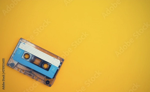 Fototapeta audio cassette on a yellow background
