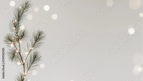 Fototapeta Minimalist Christmas Pine Branch with Bokeh Lights.