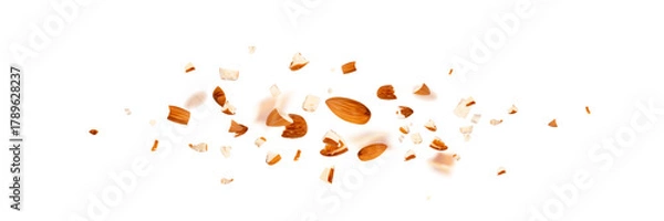 Obraz Crushed almonds falling isolated, flying nut pieces, levitate scattered almond seeds