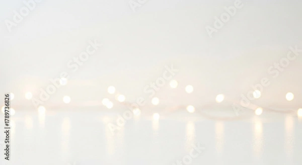 Obraz Soft, glowing fairy lights create a magical, bokeh background perfect for festive celebrations and elegant event decor, evoking warmth and joy.