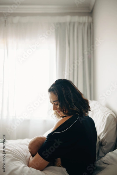 Obraz Mother nursing baby in morning light
