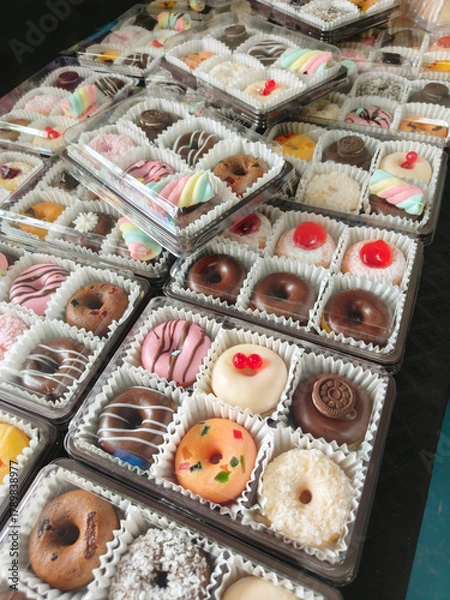 Fototapeta Colorful Donuts, Berliner, Krapfen with sugar icing and chocolate.