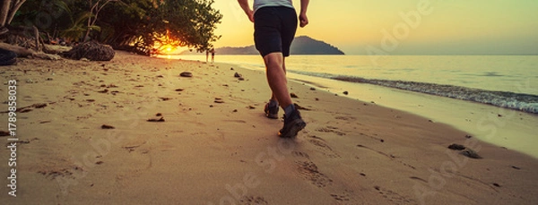 Fototapeta man fast walking on the beach