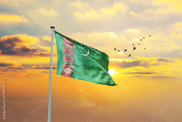 Obraz Turkmenistan flag waving in sunset or sunrise. Turkmenistan flag for Republic Day and Independence Day.