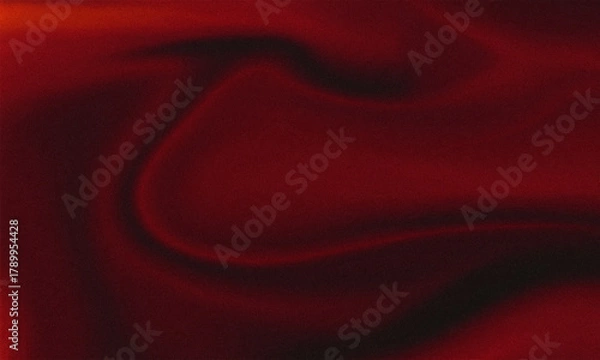 Obraz Flowing red satin silk fabric with a soft, shiny texture, creating a luxury textile backdrop or wallpaper design