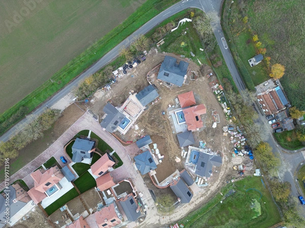 Fototapeta Drone view of a part completed new housing development site in rural Essex, UK. Both affordable and luxury family homes are on the Greenfield site.