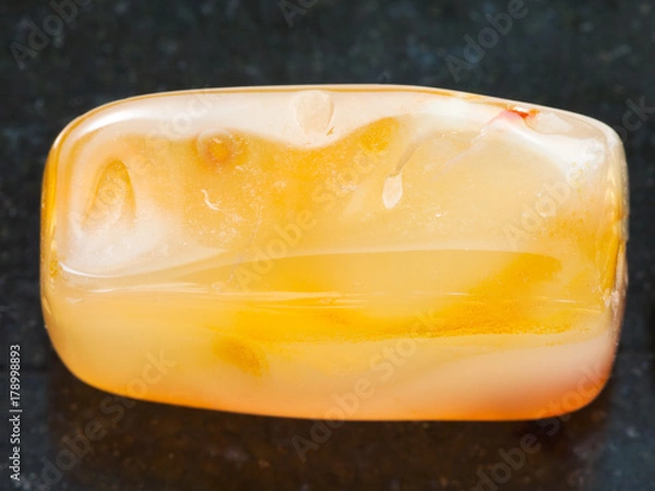 Obraz bead from yellow Agate gemstone on dark