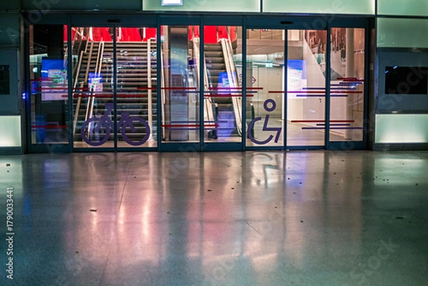 Fototapeta Round candelabra with lit candles in a Catholic cathedral. Religious holiday