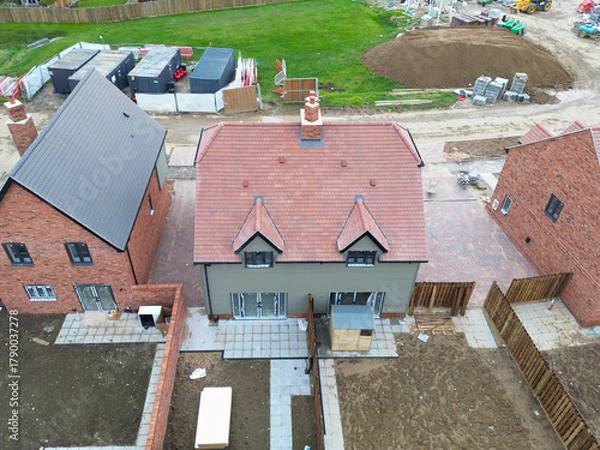 Obraz Interesting drone view of a near completed semi detached first time buyer property within a British housing development site. Note the finished garden shed on the back patio, soon to be moved.
