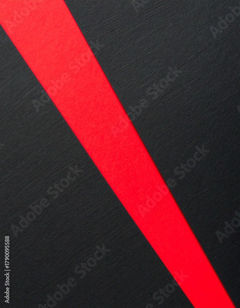 Obraz Torn black paper revealing red layer in diagonal composition