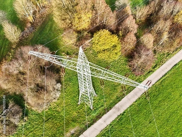 Obraz Aerial View of High Voltage Power Line Tower in Green Landscape