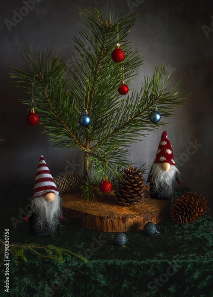 Fototapeta A prickly pine tree with Christmas toys and gnomes. Waiting for a miracle.