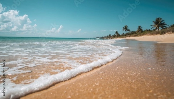 Obraz Sea water mingles with sandy beach, erosion risk