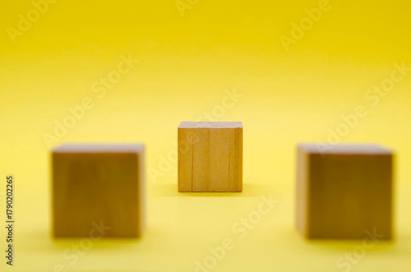 Obraz An isolated wooden cube with customizable space for text or ideas. Copy space concept.