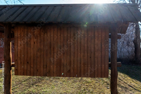 Fototapeta Mock-up billboard with blank space for advertisement in a rural outdoor setting