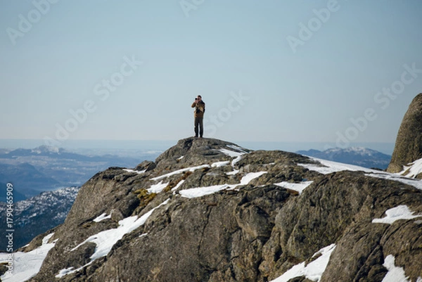 Fototapeta Photographer on Snowy Mountain Peak