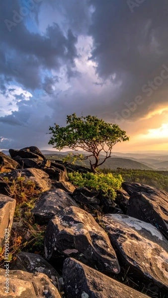 Fototapeta Dramatic sky over rocky landscape
