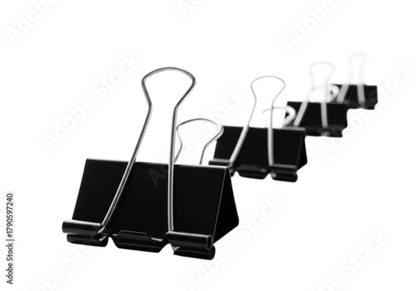 Obraz Several black binder clips arranged in a row
