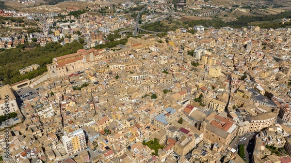 Fototapeta Aerial view of the historic center of Agrigento, Sicily, Italy. This Sicilian capital, located on a hilltop, was known in ancient times as Akragas. It's a beautiful, sunny summer day.