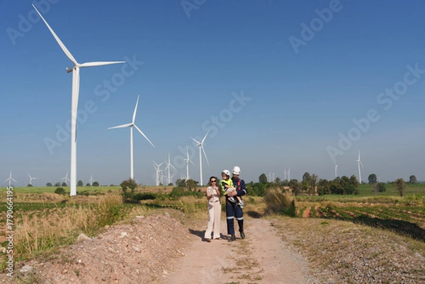 Fototapeta International engineers are investigating the operation of natural energy systems such as wind turbines and electric power.