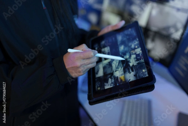 Fototapeta Security officers are checking the TV screen of the CCTV system. 