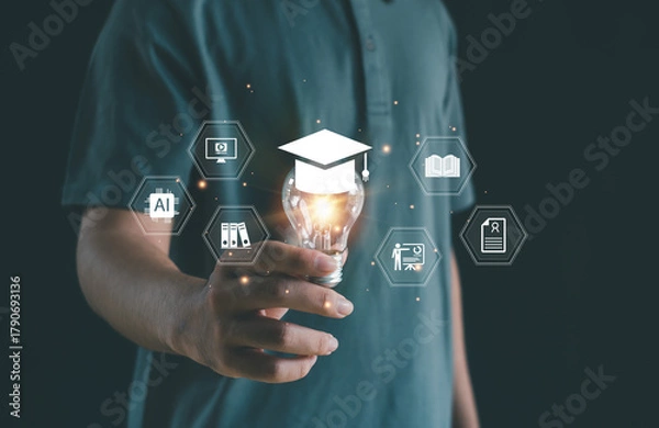 Fototapeta Creative education concept with glowing light bulb and graduation cap representing digital learning, AI innovation, and smart knowledge for modern academic and technology development.