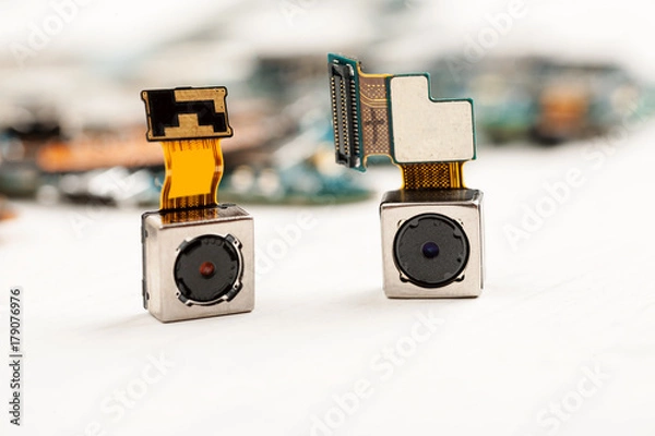Fototapeta Smartphone camera modules on a white background, closeup