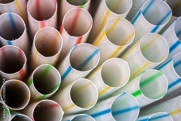 Fototapeta Macro view of colorful striped drinking straws in close-up