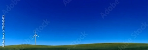Obraz Wind Turbine on Green Field against Deep Blue Sky A Sustainable Energy Landscape Offering Clean Power and Environmental Harmony The Future of Renewable Resources and Ecological Balance 