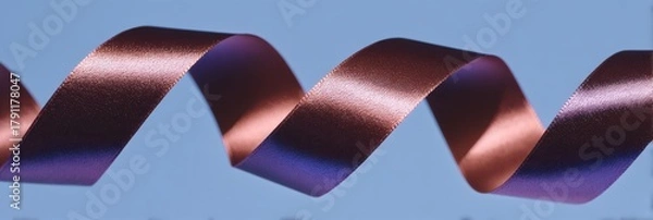 Obraz Macro closeup of glossy ribbon with an elegant copper and blue color gradient, forming an abstract fluid design.