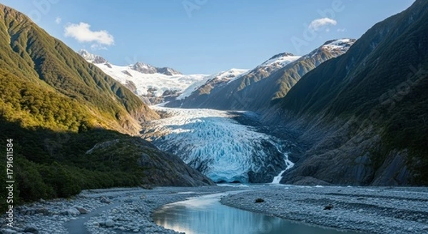 Obraz Majestic glacier descends through verdant valleys under a serene summer sky creating breathtaking