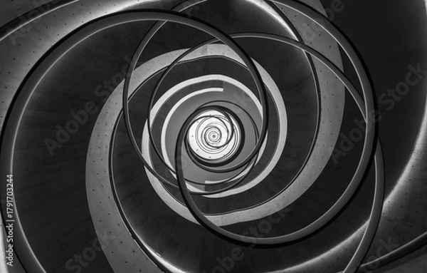 Fototapeta Black and White Spiral Staircase with Curved Lines and Light Accents