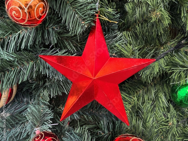 Obraz christmas tree decoration, close up of shiny red star on tree
