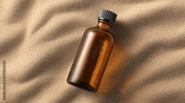 Obraz Amber bottle on sand background spa wellness aromatherapy