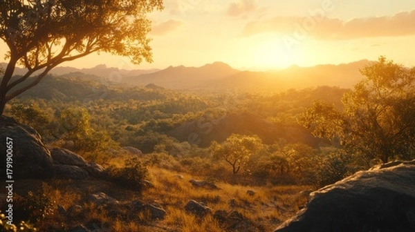 Fototapeta Golden sunset over a mountain valley