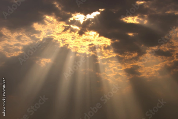 Fototapeta Light bursting from the horizon forming a subtle cross in the clouds, symbol of resurrection and new beginnings