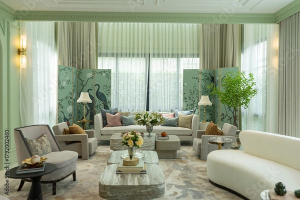 Obraz Interior of a luxurious sitting room with bay window sofas and coffee table. White and green tone of vast luxury living room.

