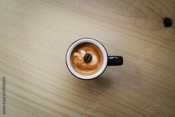 Fototapeta A clean, minimalist flat lay photograph of a single espresso shot