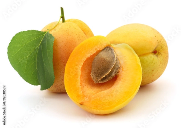 Obraz Fresh apricots with leaf and seed isolated on white background