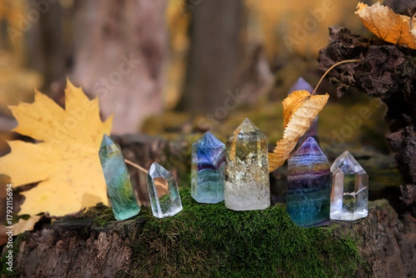 Fototapeta set of colorful crystal minerals close up in autumn forest, abstract nature background. gemstones for Magic Crystal Ritual, Witchcraft. spiritual esoteric practice for meditation, relax. Lithotherapy
