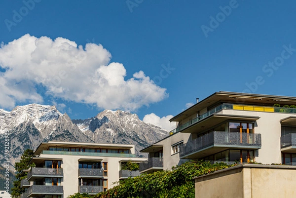 Fototapeta Modern Residential Apartments with Mountain View and Blue Sky in Sunny Weather