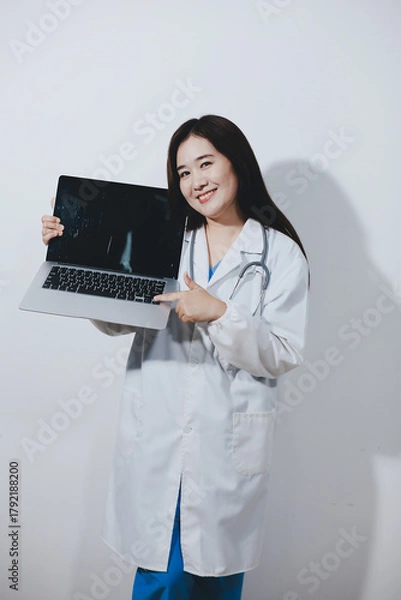 Fototapeta Female druggist standing with a digital tablet