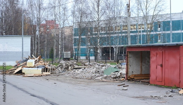 Obraz Demolition of old concrete garages in the courtyard of an apartment building, Prospekt Bolshevikov, Saint Petersburg, Russia, November 12, 2025
