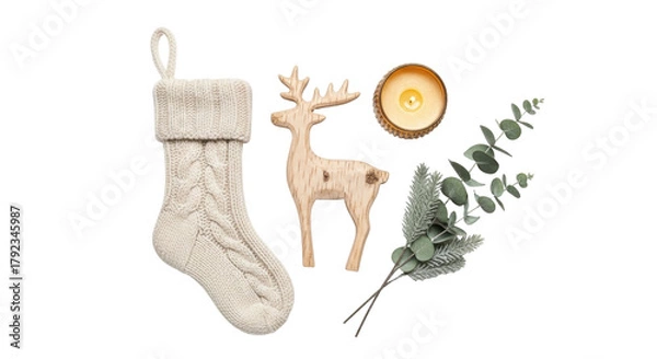 Obraz Isolated knitted Christmas stocking, wooden reindeer, candle, and greenery for festive season