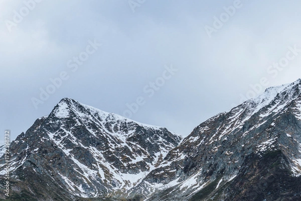 Obraz moody autumn cold day in carpathian peaks with snow on top low visibility