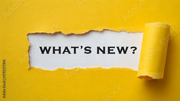 Fototapeta Exciting whats new message revealed behind torn yellow paper, representing innovative announcements